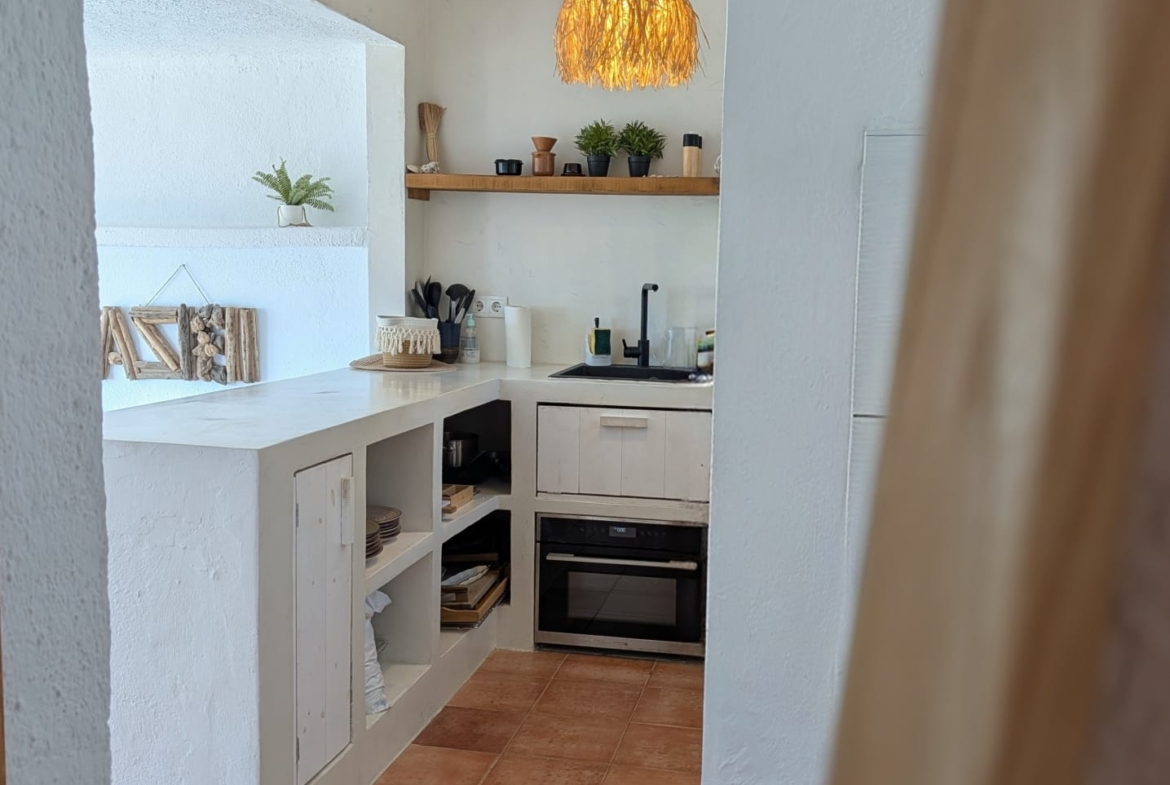 Boho Chic Sea View Apartment with Private Rooftop in Cala Vadella for Summer Rent
